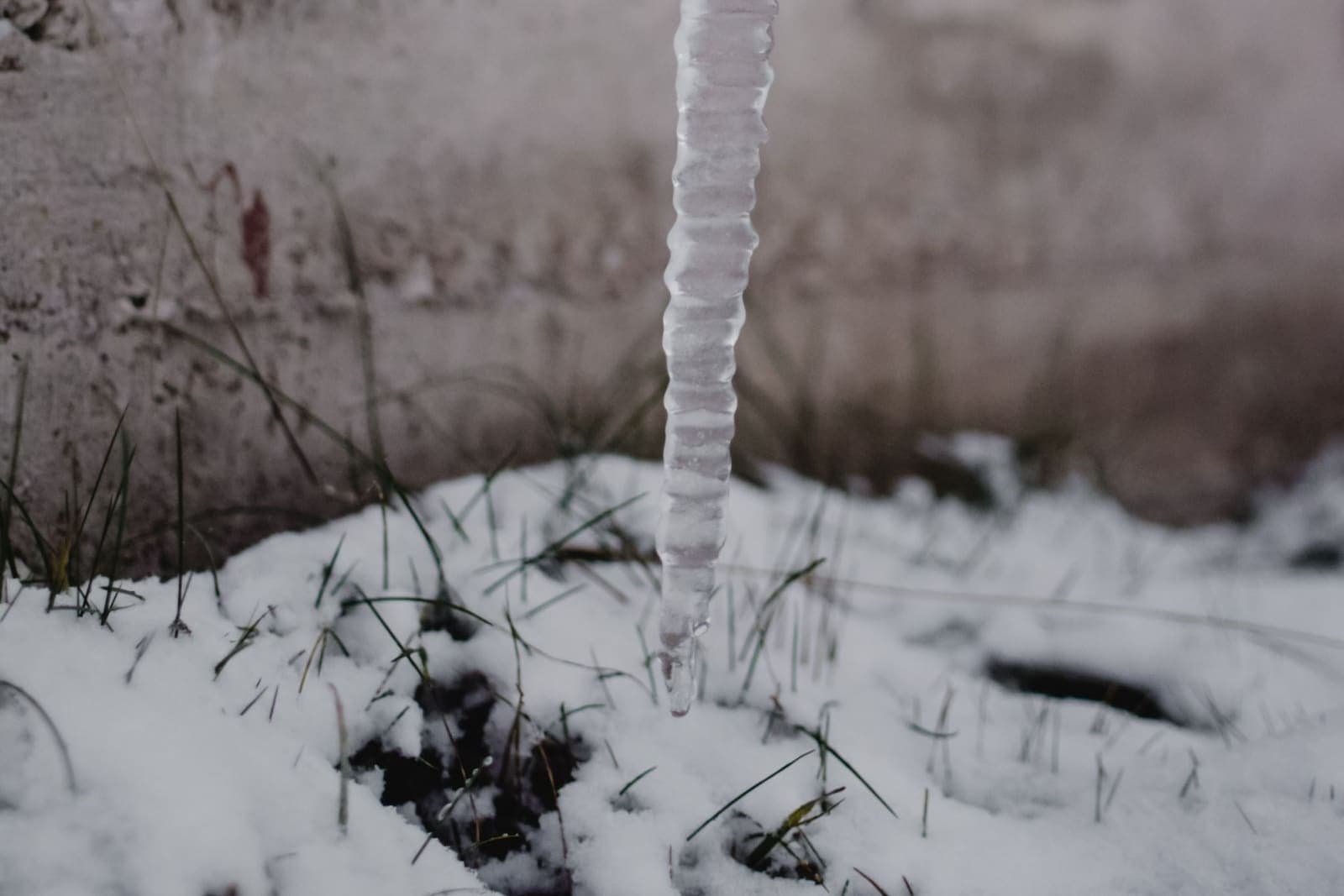 Ice hanging from a frozen drain spout