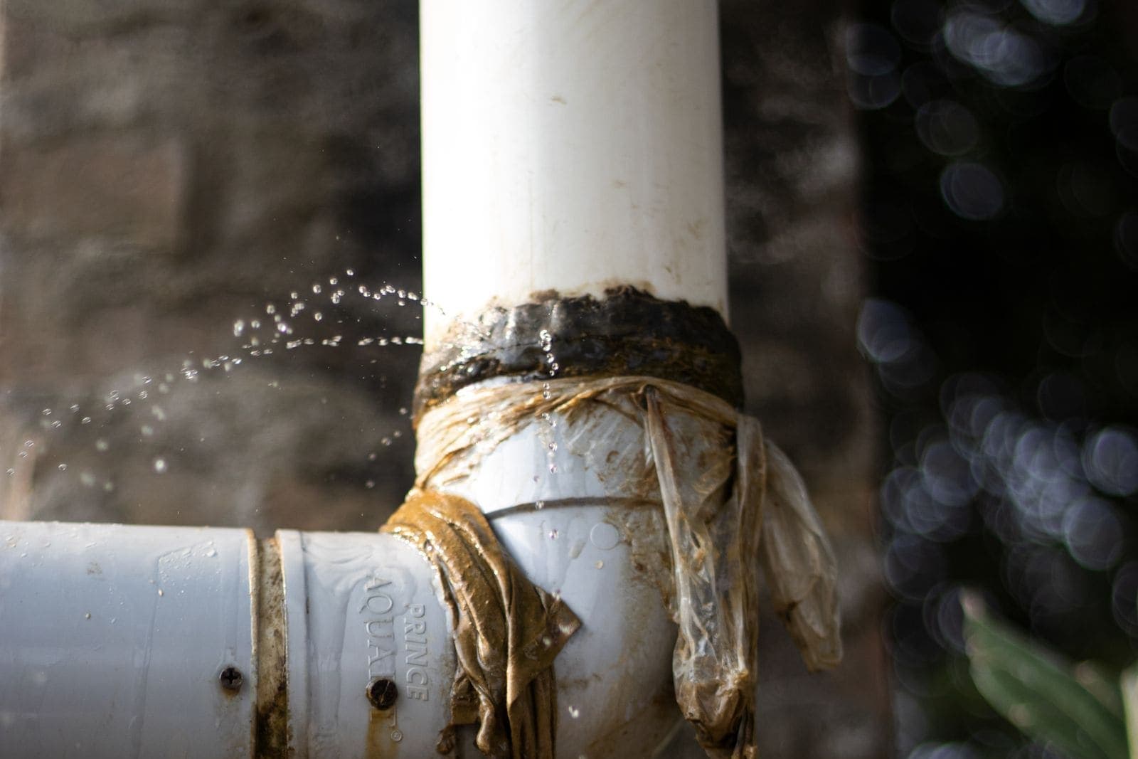 Leaking pipe wrapped in plastic as a temporary fix