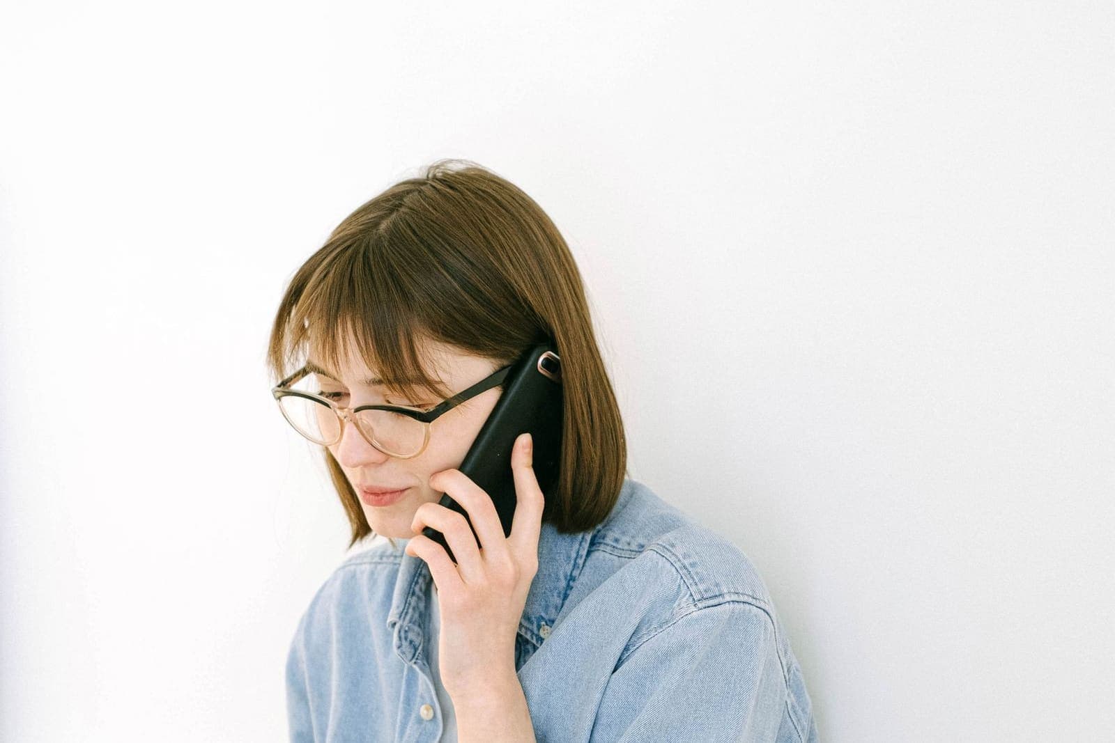 Woman talking on the phone at home